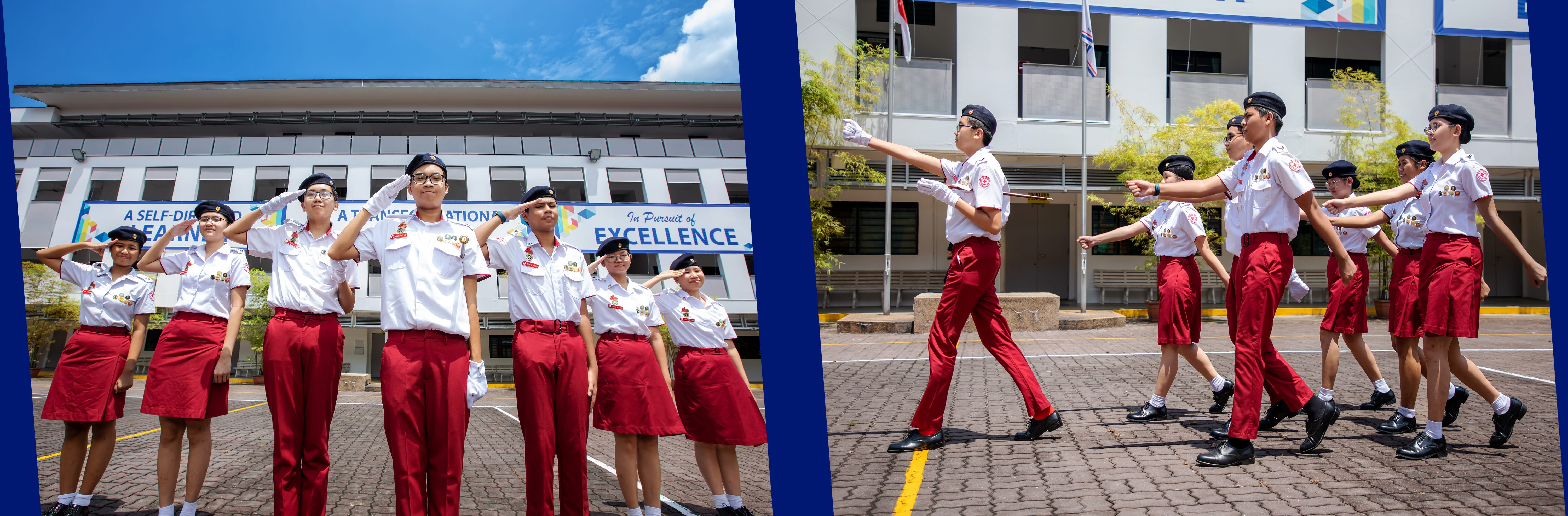 Students in white and red uniforms salute and march in formation outside a school building.